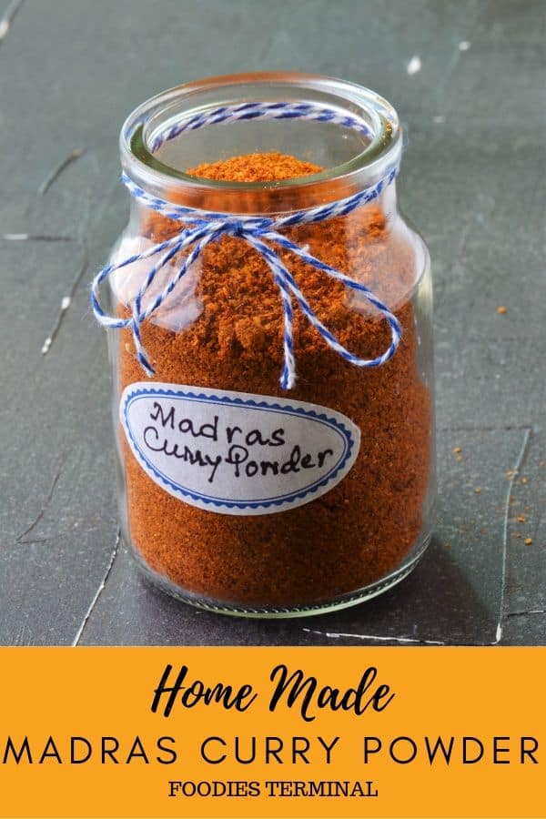 Madras Curry powder recipe in a glass container with name plate