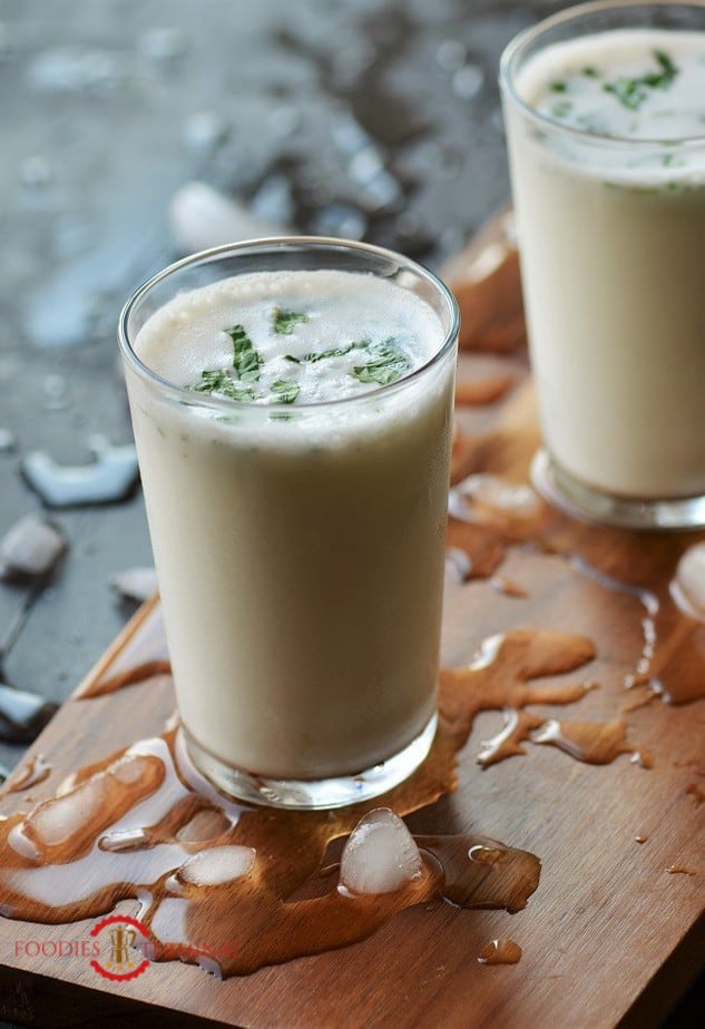 Spiced up Masala Chaas served in two glasses on a wood board