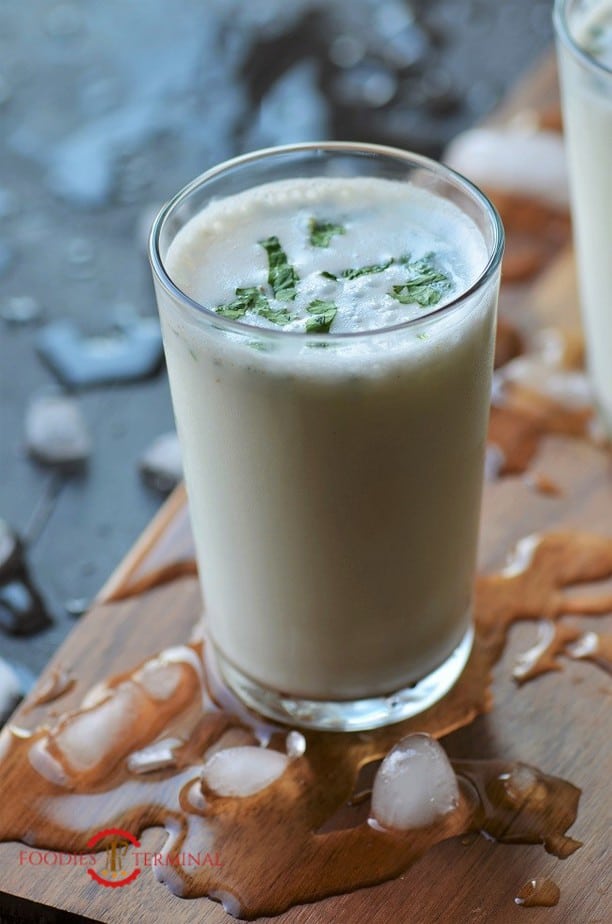 Masala Buttermilk in a glass with crushed ice by the side