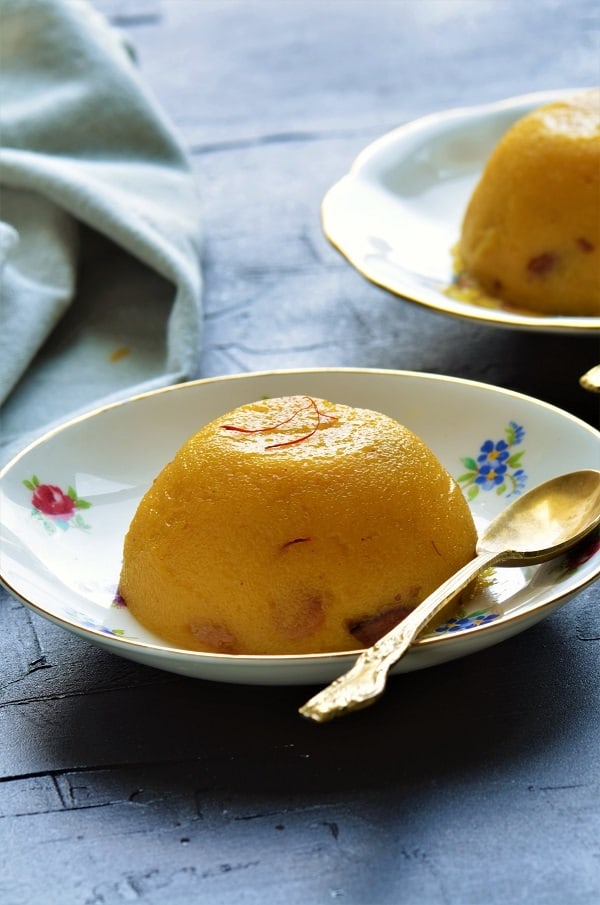 Instant Pot Mango Kesari with mango pulp in two saucers