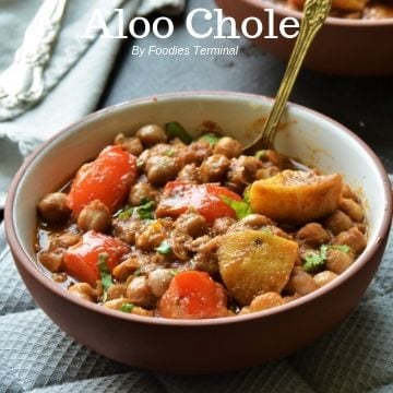 Aloo Chole recipe in a bowl with spoon