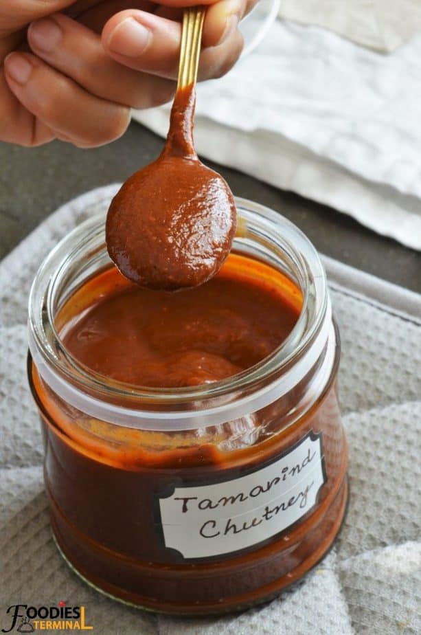 Instant Pot Tamarind chutney scooped out from a jar