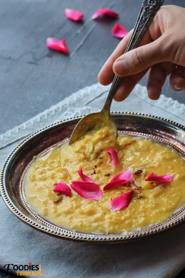 Mango kheer recipe in a silver plate with a spoon 