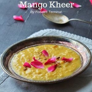 Mango rice kheer in a silver plate with rose petals