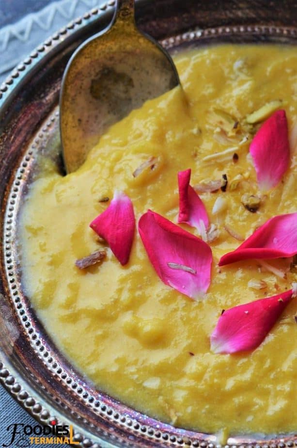 Mango rice kheer garnished with red rose petals