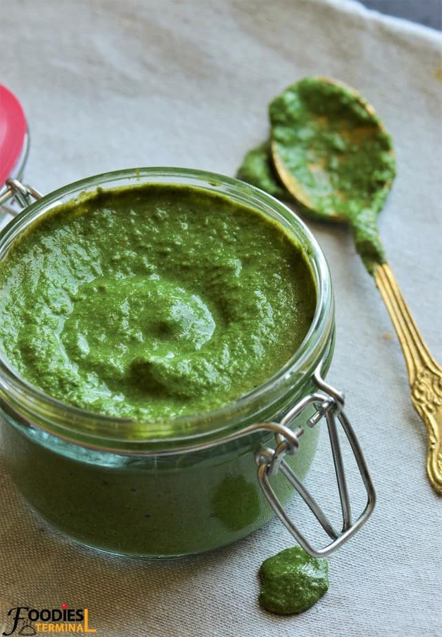 Pudina chutney close up view in a transparent pot