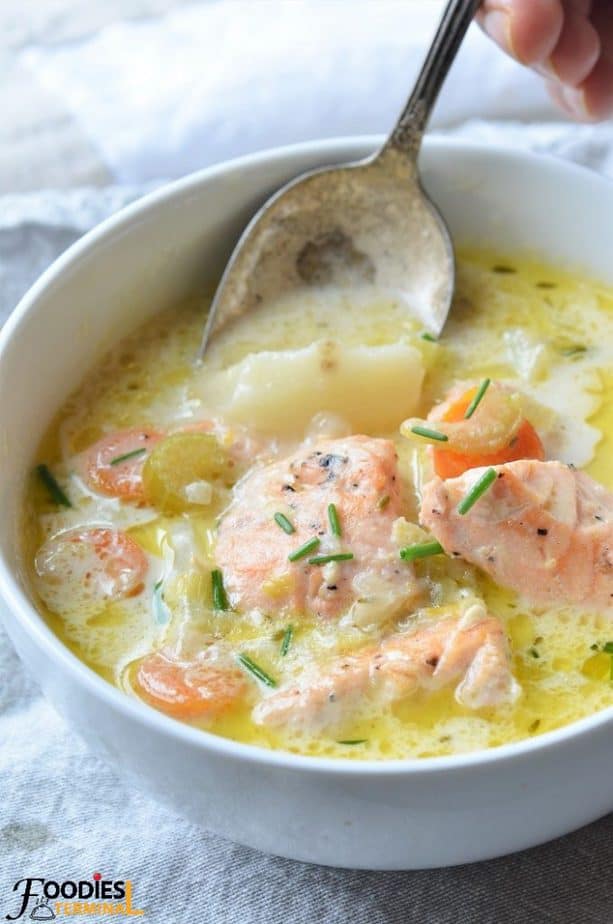 Healthy Salmon Chowder Soup with a spoon inside soup