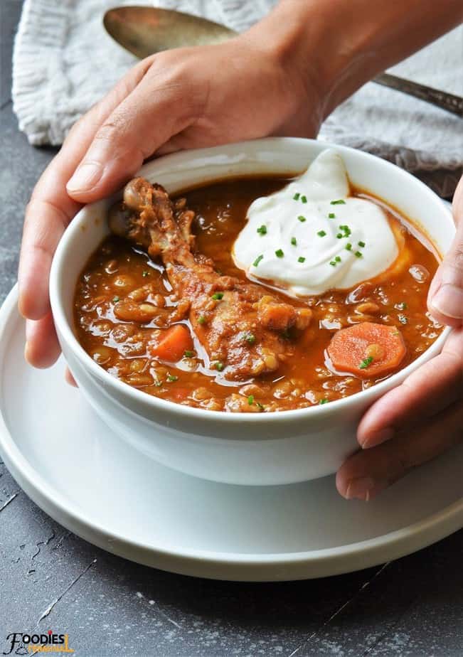 slow cooker chicken lentil stew recipe in white bowl