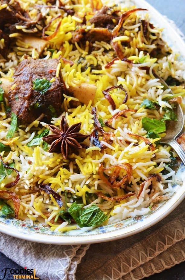 Authentic mutton biryani recipe with fluffly yellow white basmati rice