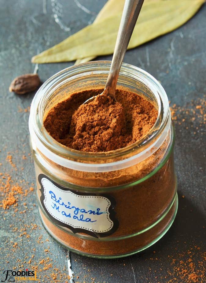 Pakistani Biriyani masala powder in a jar with a spoon