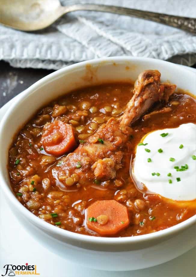 Chicken Lentil stew with a chicken drumstick in bowl