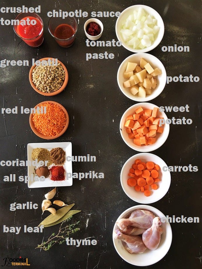 lentil chicken stew recipe ingredients in bowls on a black surface