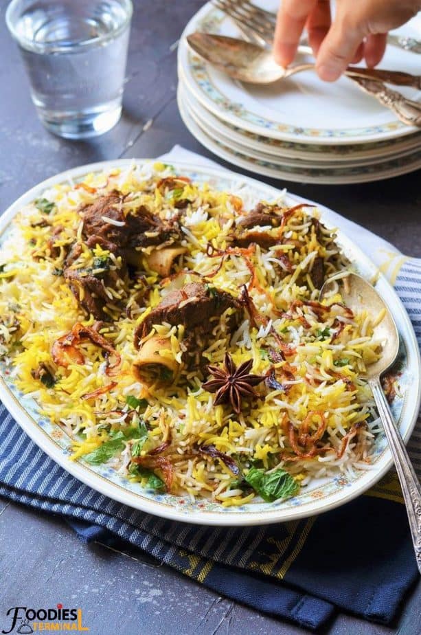 Easy Mutton Biryani recipe with mutton on the bones on top