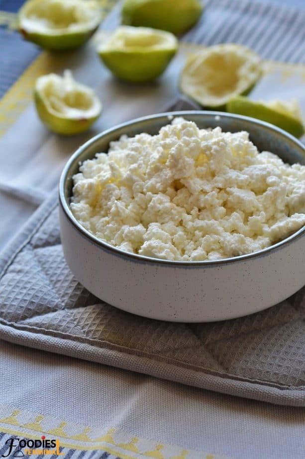 homemade chena recipe in a bowl with lime shells in the backdrop