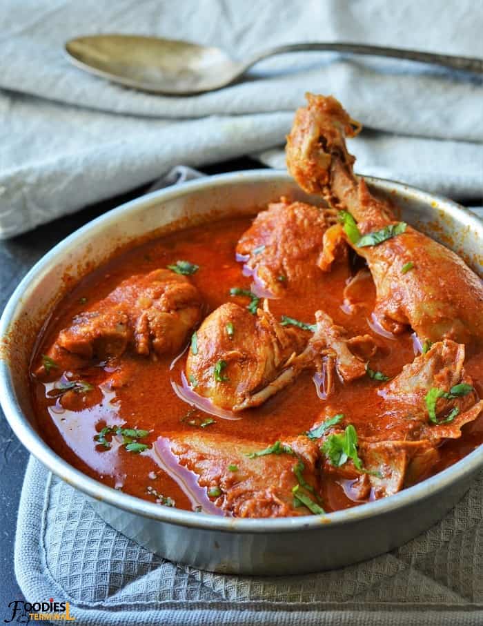 Oil free chicken curry in an aluminum bowl