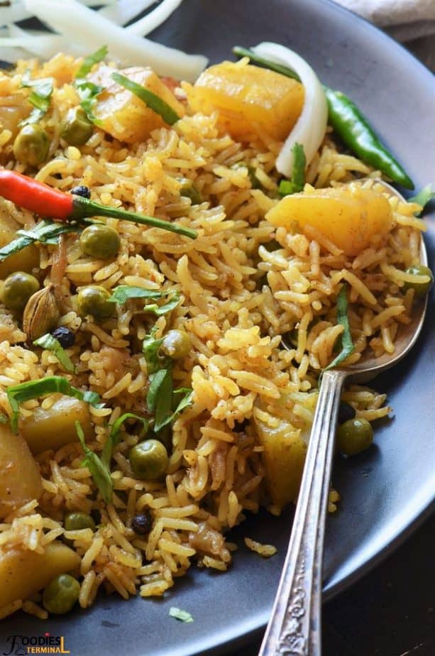 Aloo Matar Pulao garnished with cilantro