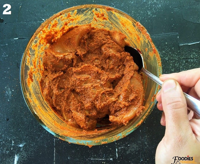 Marinating chicken in a clear glass bowl