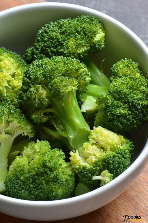Instant pot broccoli florets in a white bowl