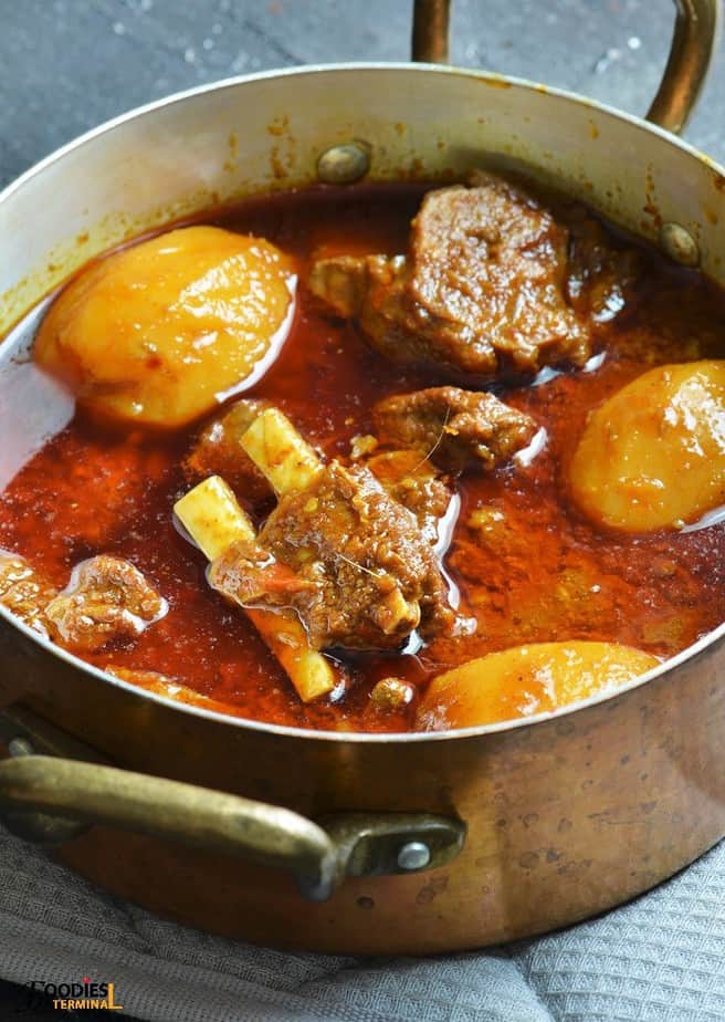 Instant pot aloo gosht served in copper vessel