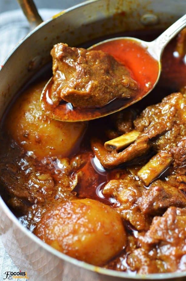 Aloo Gosht pakistani style in a silver spoon