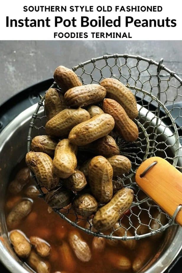 instant pot boiled peanuts in a slotted spoon 