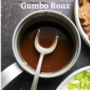 gumbo roux recipe in a small saucepan with a spoon