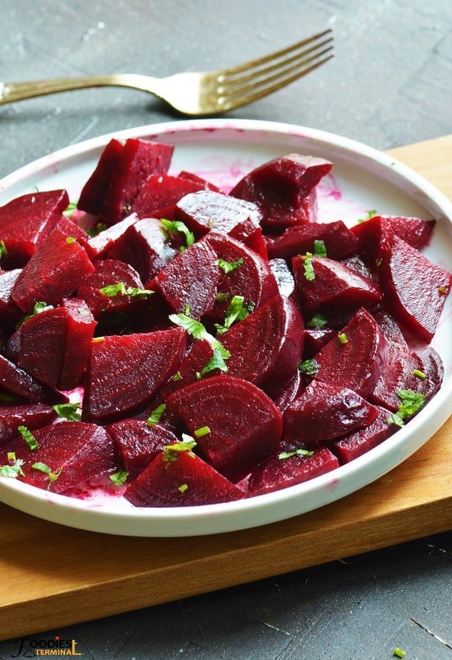 Diced steamed beets on a white plate
