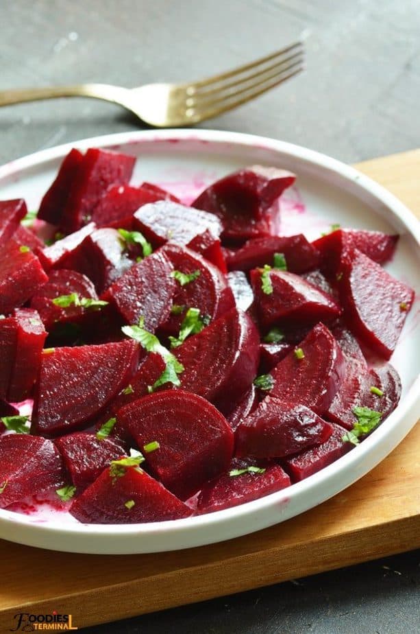 steamed beets instant pot diced & served on a white plate with fork