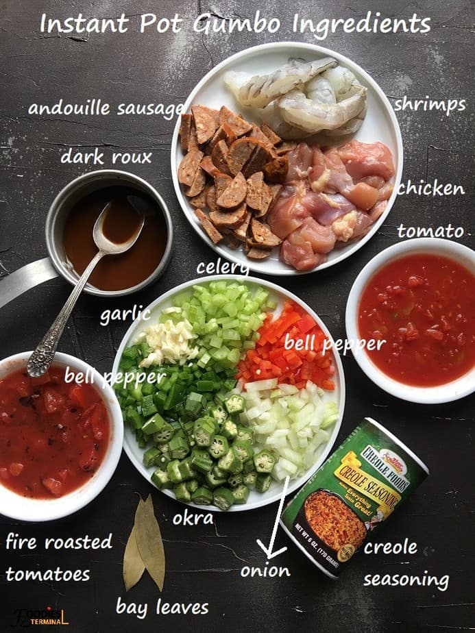 gumbo ingredients on a black surface
