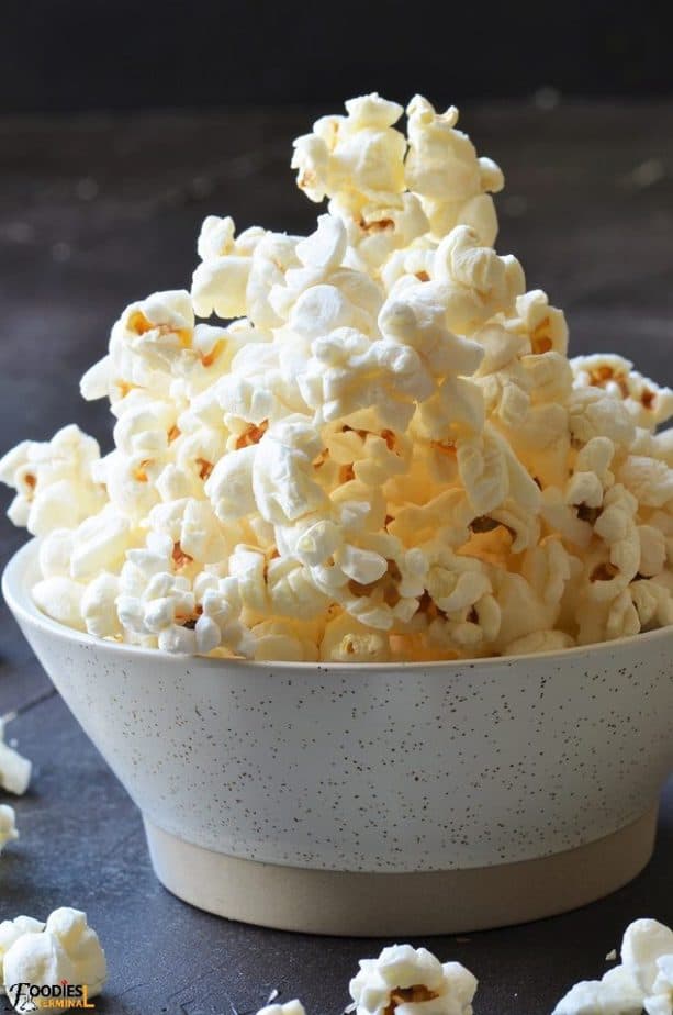 Instant pot popcorn in a beige bowl