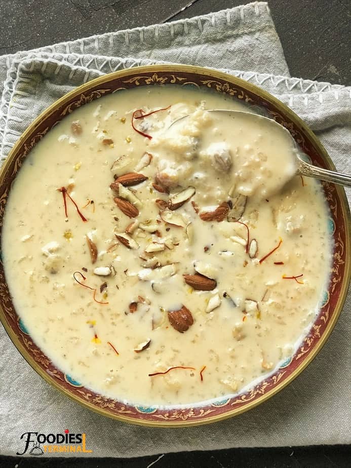 Instant Pot Kheer garnished with saffron & almonds in a bowl