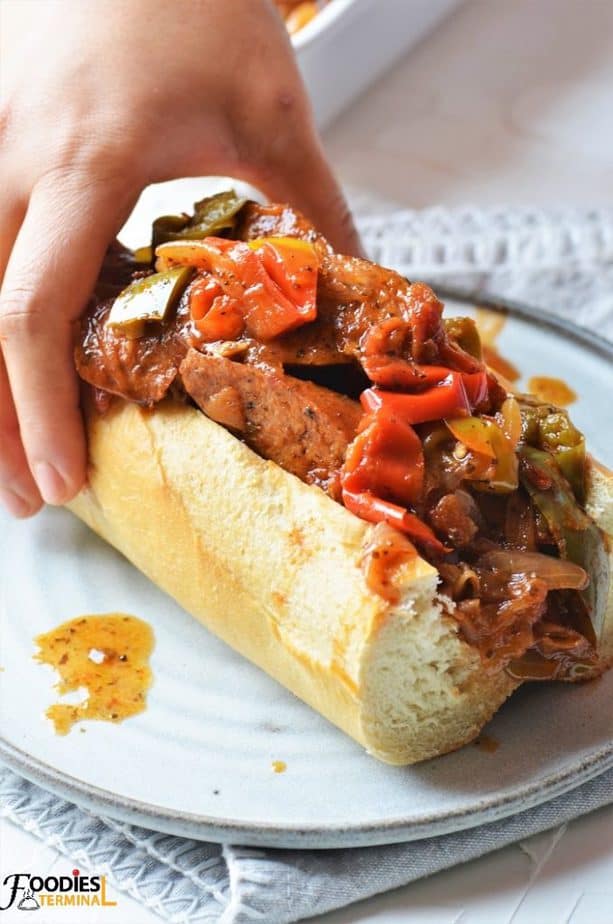 Sausage and Pepper Sandwich in a baguette on a grey plate