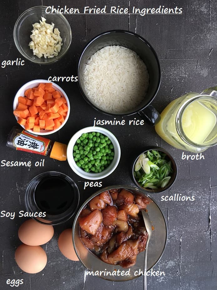 Chicken fried rice ingredients on a black surface