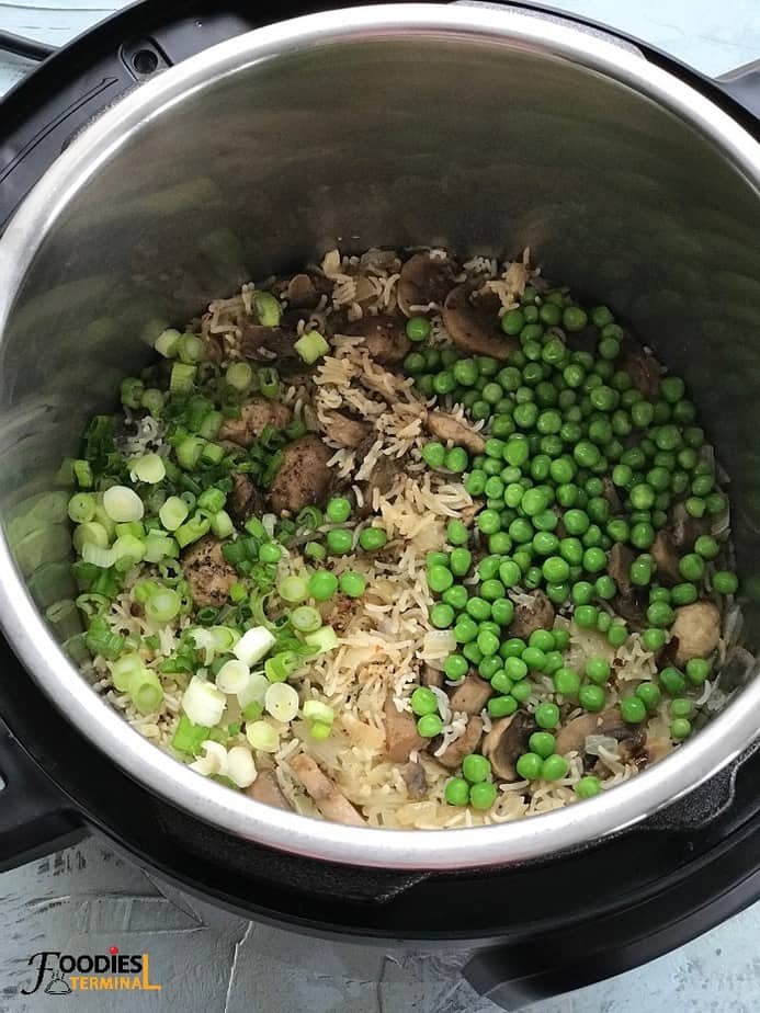 thawed peas & scallions in the cooked mushroom rice in instant pot