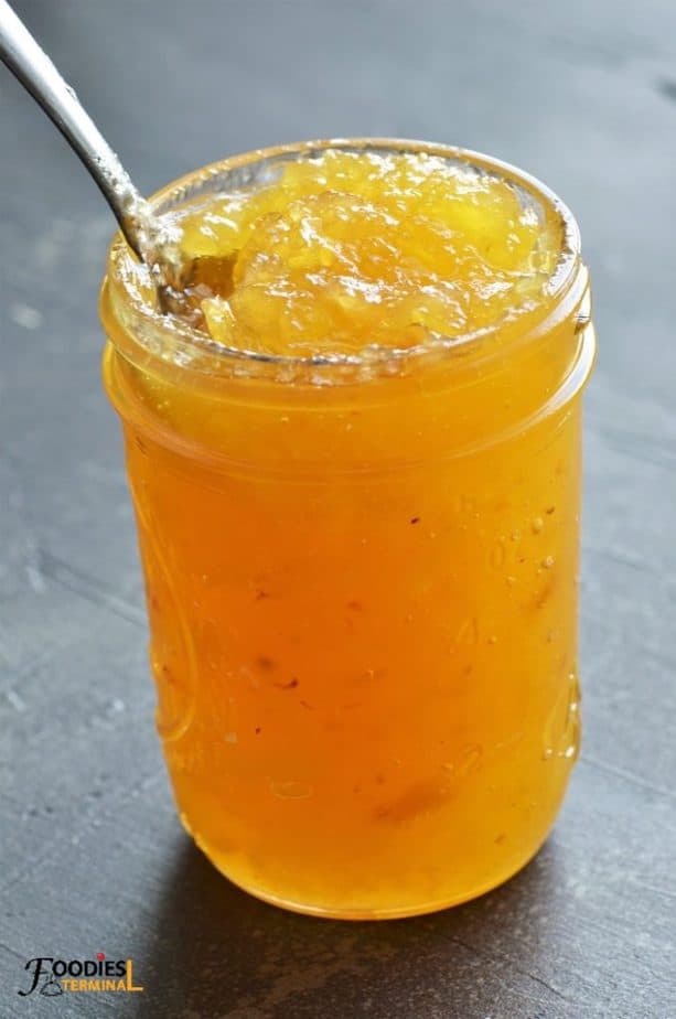 Instant Pot Pineapple Jam in a mason jar with a spoon