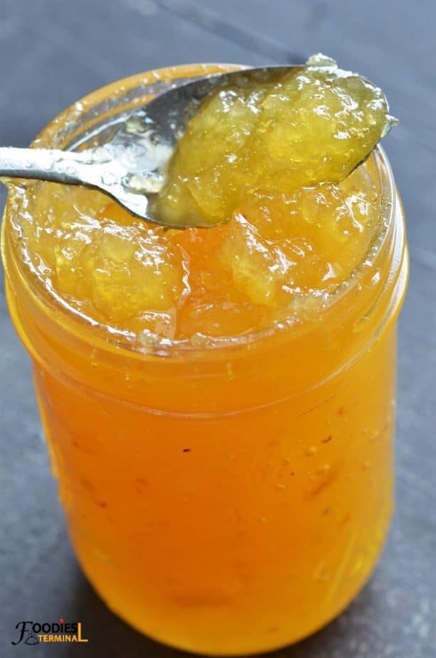 Instant Pot Pineapple jam without pectin in a spoon from a small jar