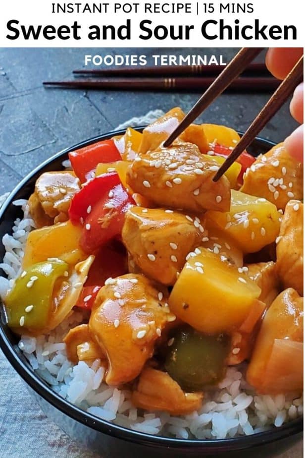Instant Pot sweet and sour chicken with pineapple being lifted with chopsticks