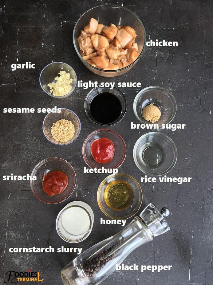 ingredients in bowls on a black surface