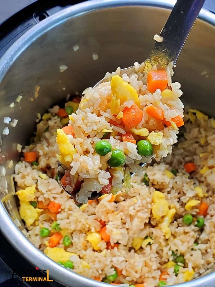 Hibachi Fried Rice in instant pot and lifted in a ladle