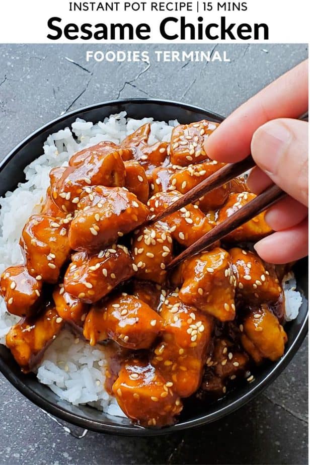instant pot sesame chicken on jasmine rice in black bowl garnished with sesame seeds with chopsticks