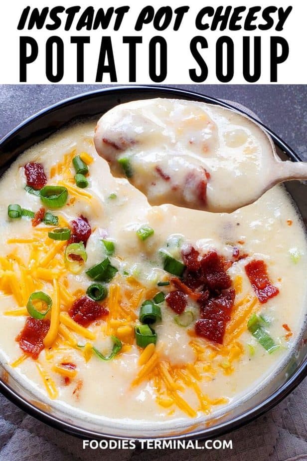 instant pot loaded cheesy potato soup scooped out on a spoon from a black bowl