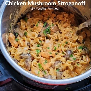 instant pot chicken mushroom stroganoff garnished with chopped fresh prasley
