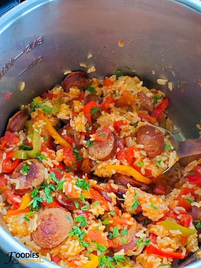 sausage and rice instant pot recipe garnished with parsley in instant pot 