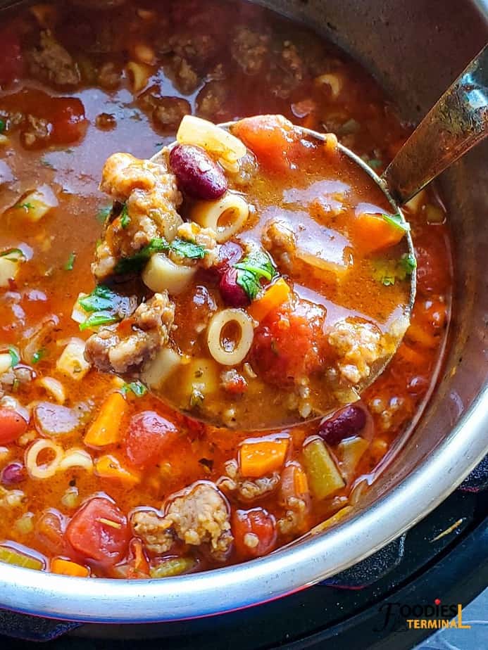 instant pot pasta e fagioli soup in a ladle 