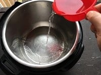 pouring water inside instant pot steel insert