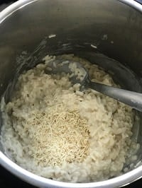 parmesan chesse on top of the cooked arborio risotto rice