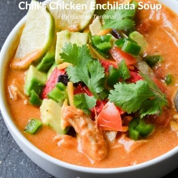 chili's enchilada soup instant pot in a white bowl with toppings