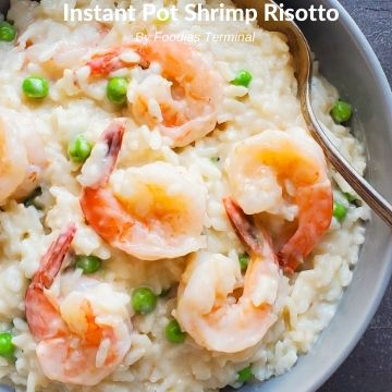 instant pot shrimp risotto served in a grey bowl with a spoon