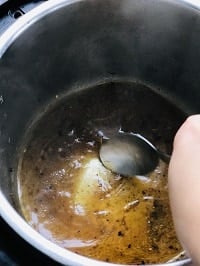 deglazing pot with the help of a steel ladle