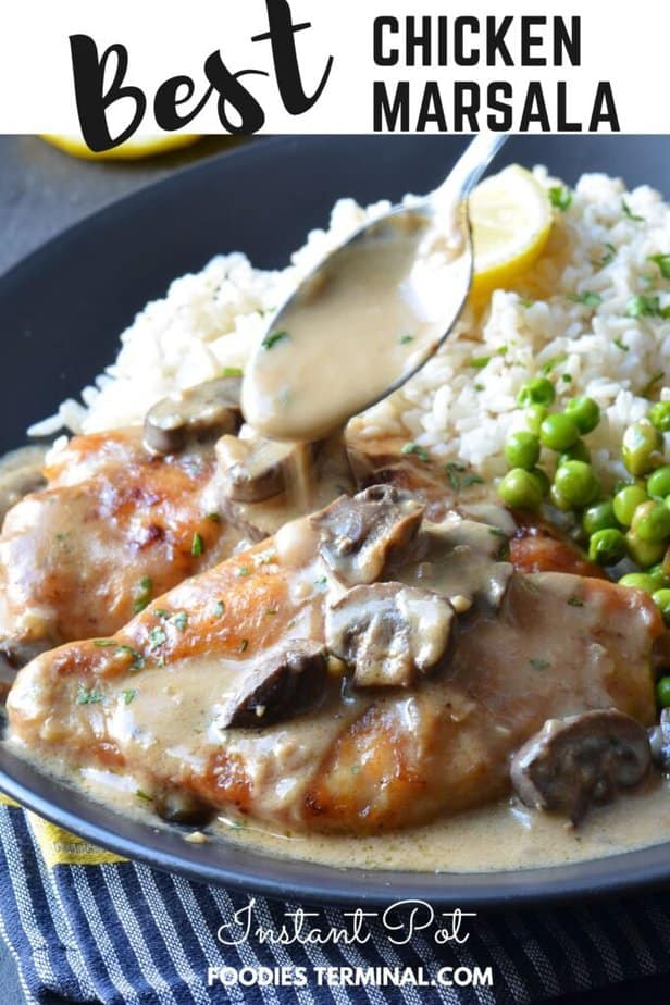 pouring creamy marsala sauce on chicken cutlet with a spoon